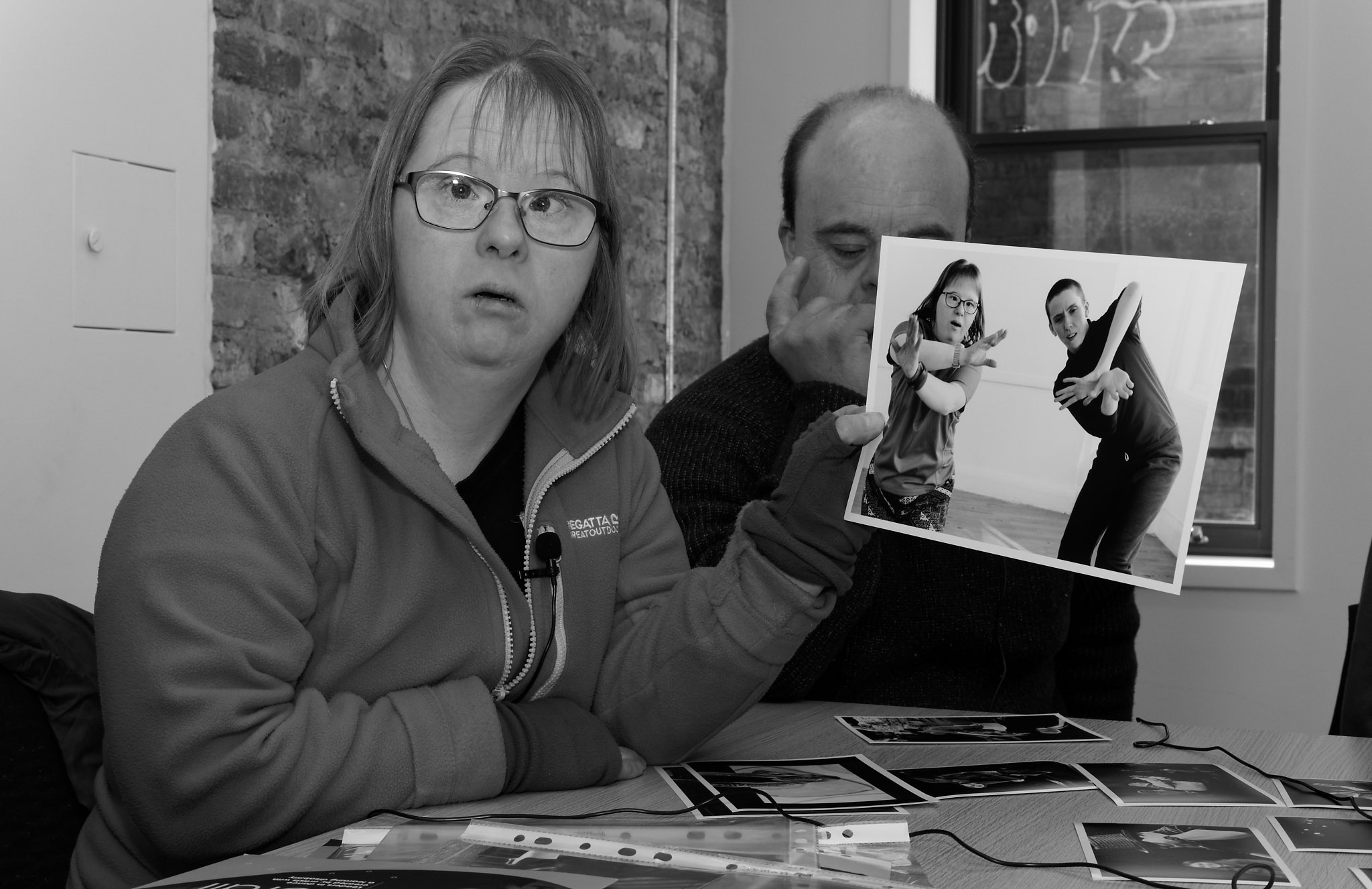 Bethan holding a photograph of herself at an interview