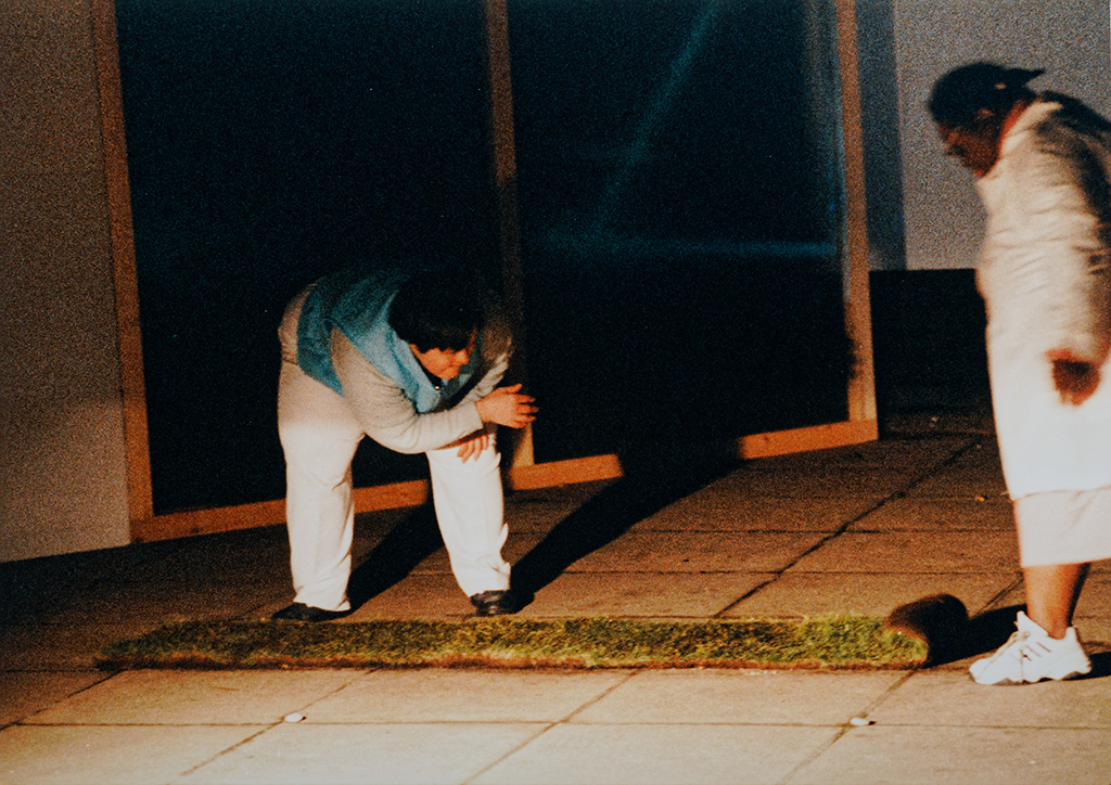 Photo of Laura with Natalie outside Tate Modern dancing on some turf