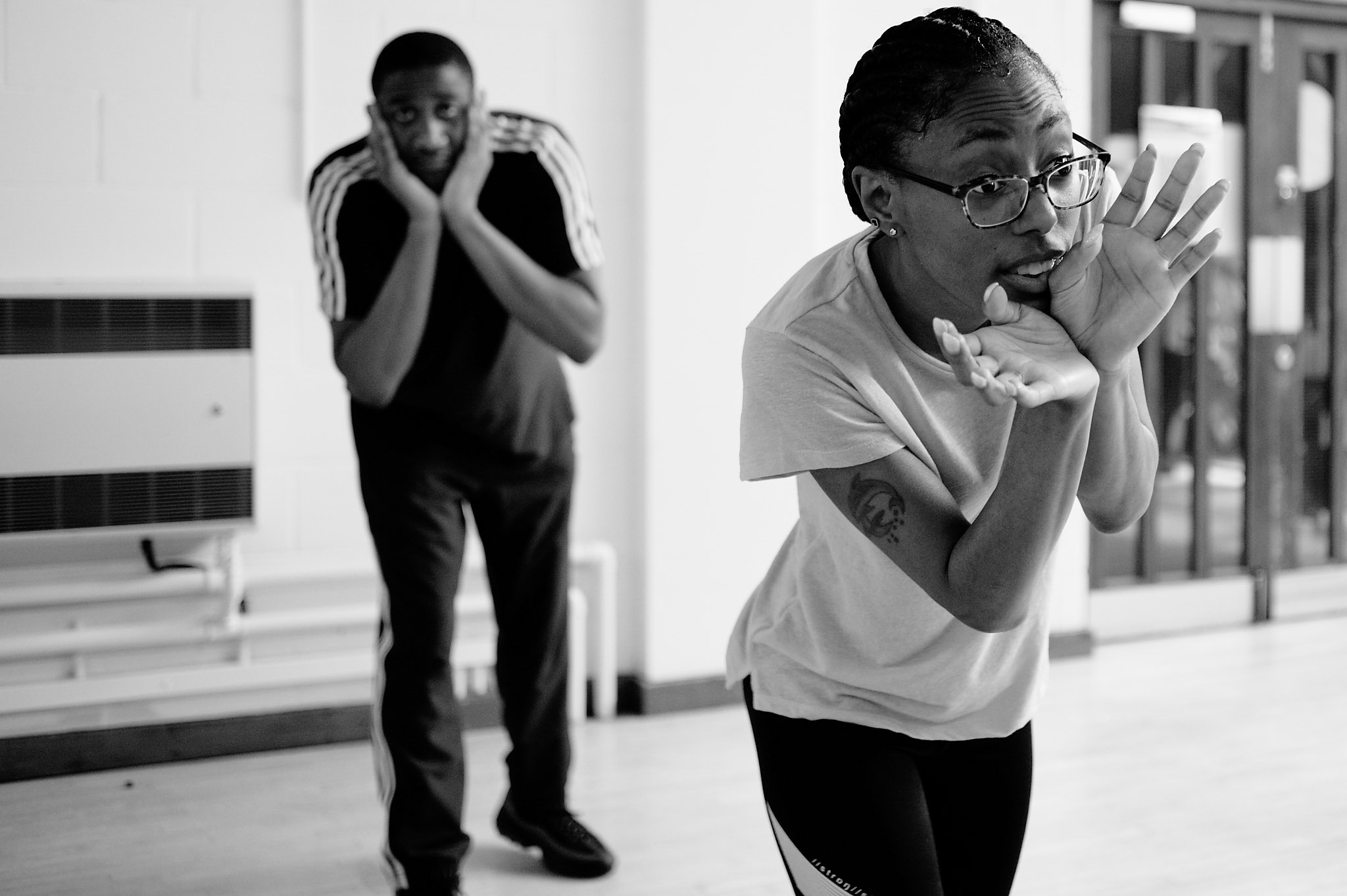 Black and white photo of Nicole dancing at Professional Development Class sharing